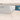 Cuchillo cocinero con mango azul sobre plato